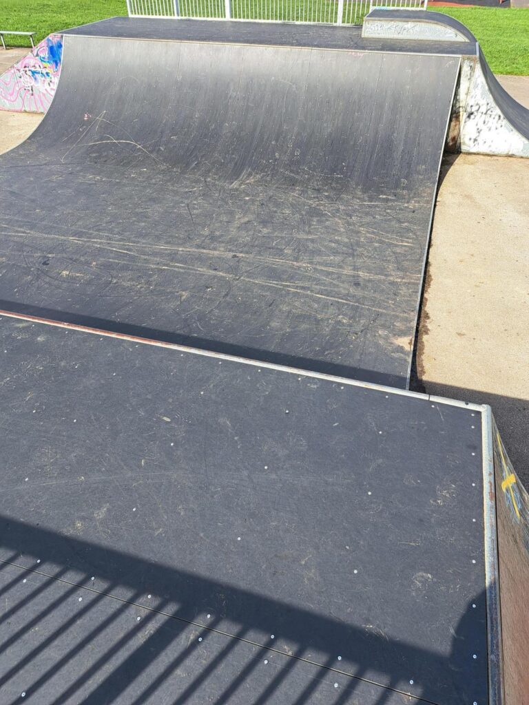 Photo of the half pipe skate ramp with its new surfacing.