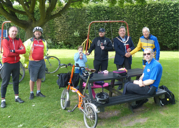 Group of cyclists in Richmond Park. A member of the team shaking the hand of the Mayor of Gainsborough Cllr Kenneth Woolley.